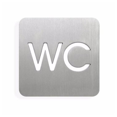 A modern restroom sign made of stainless steel. The letters "WC" are clearly visible and neatly designed. | © Barrierefreies WC